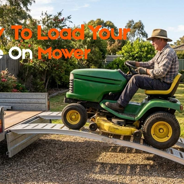 side profile of curved aluminium mower ramps spanning from ground to box trailer