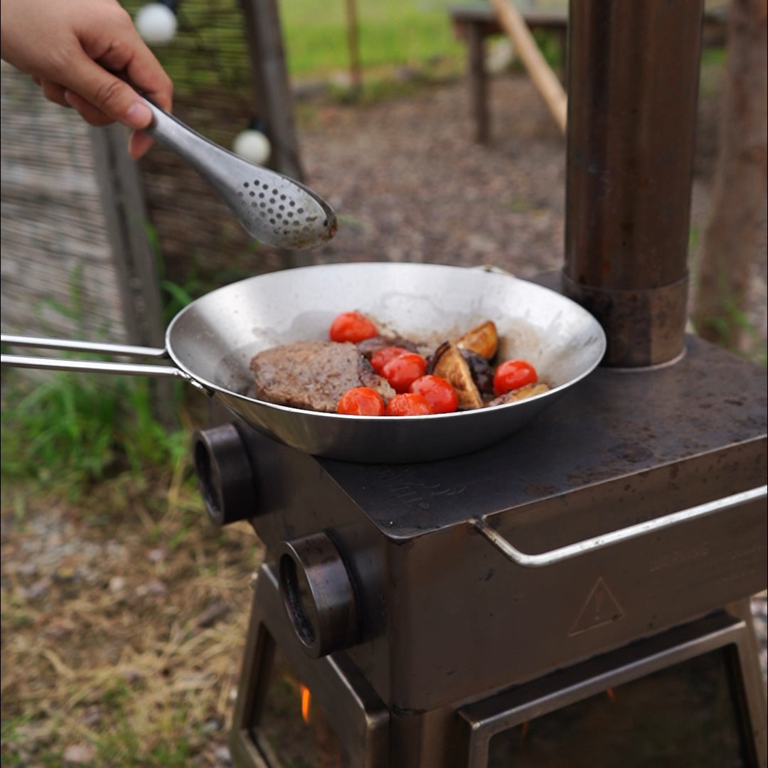 Winnerwell titanium camping deep skillet in use outdoors cooking at camp