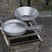 Winnerwell stainless steel Sierra camping cookware bowl and plate set on an outdoor grill