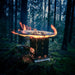 Winnerwell Mini Multi-functional BBQ Smoker burning at campsite — portable camping smoker and firepit outdoors